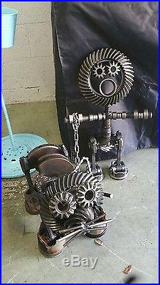 Metal yard art dog cat guy sculpture